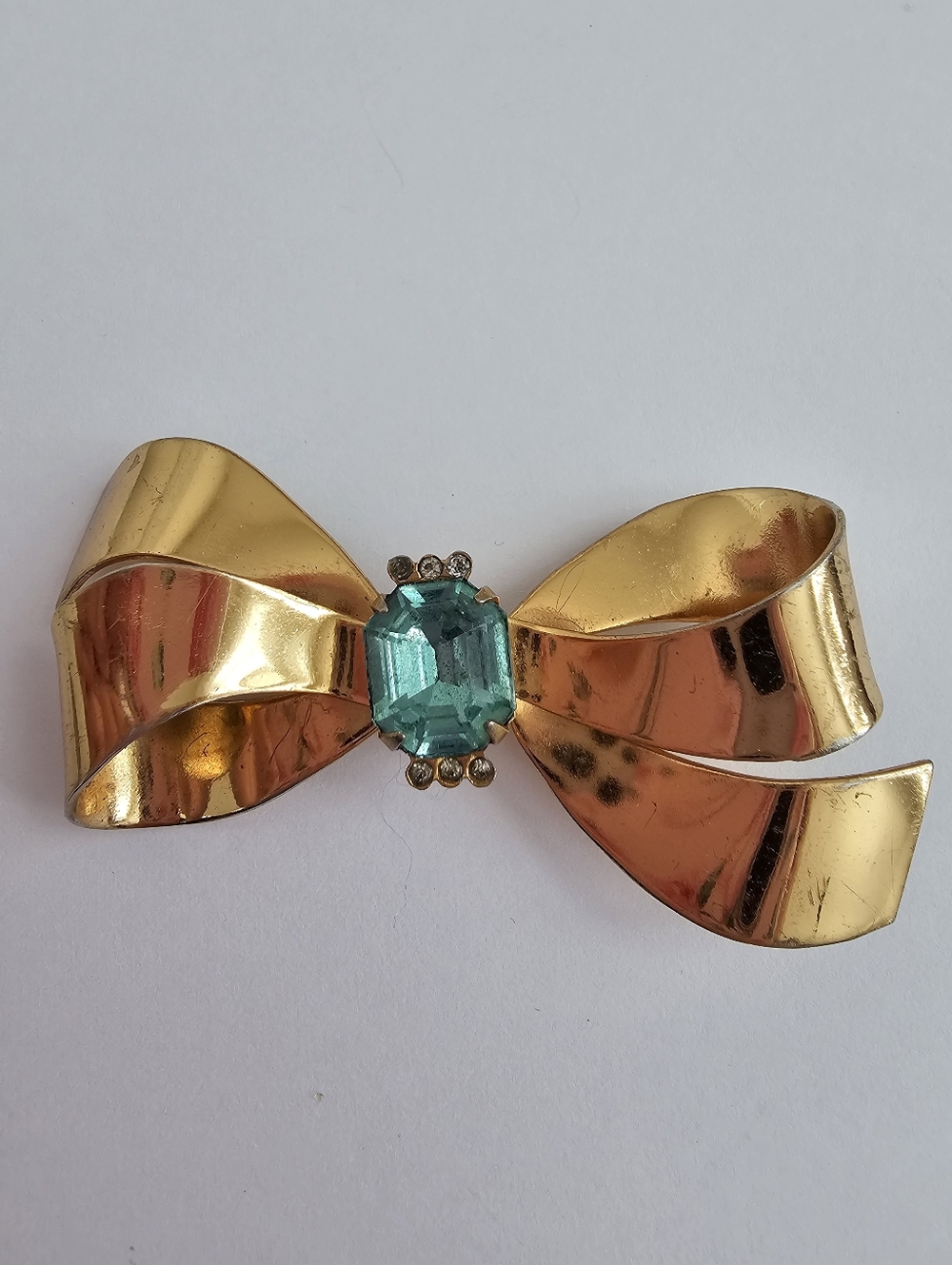 Vintage 1940s Coro Gold-Tone Bow Brooch with Aqua Center